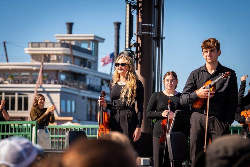 Orchestra students playing at Disney Springs