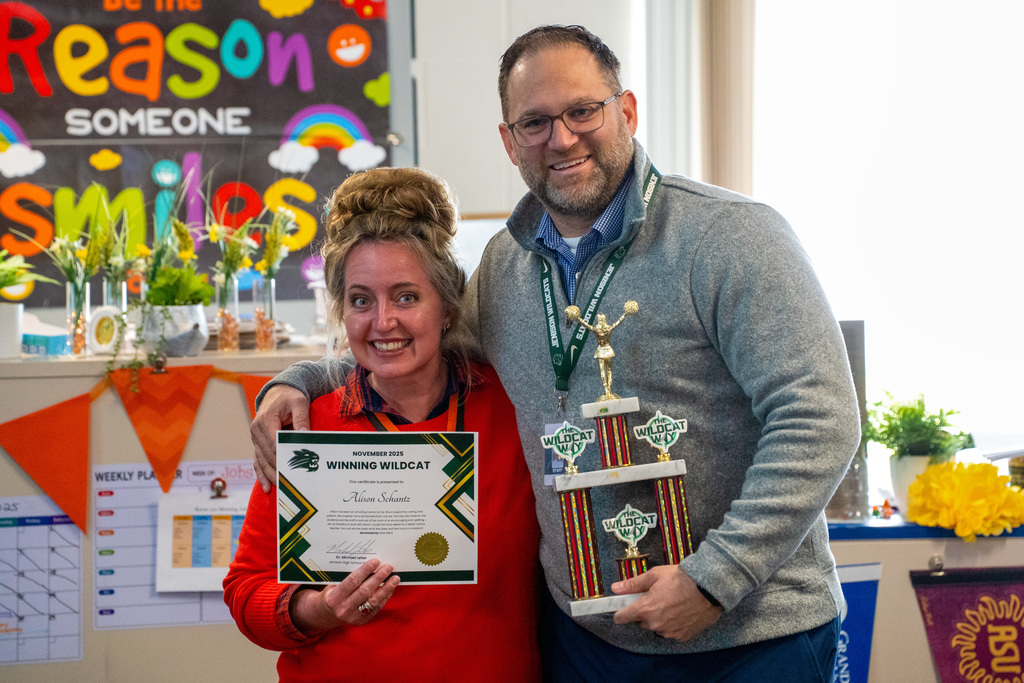 Staff celebrating Winning Wildcat and Strut Your Stuffing