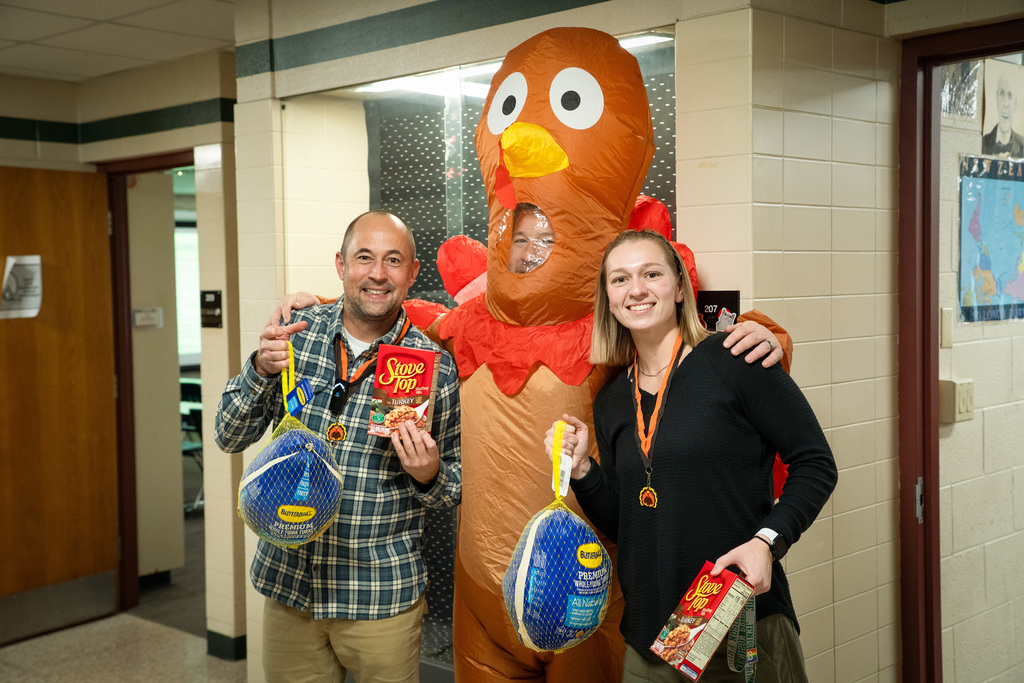 Staff celebrating Winning Wildcat and Strut Your Stuffing