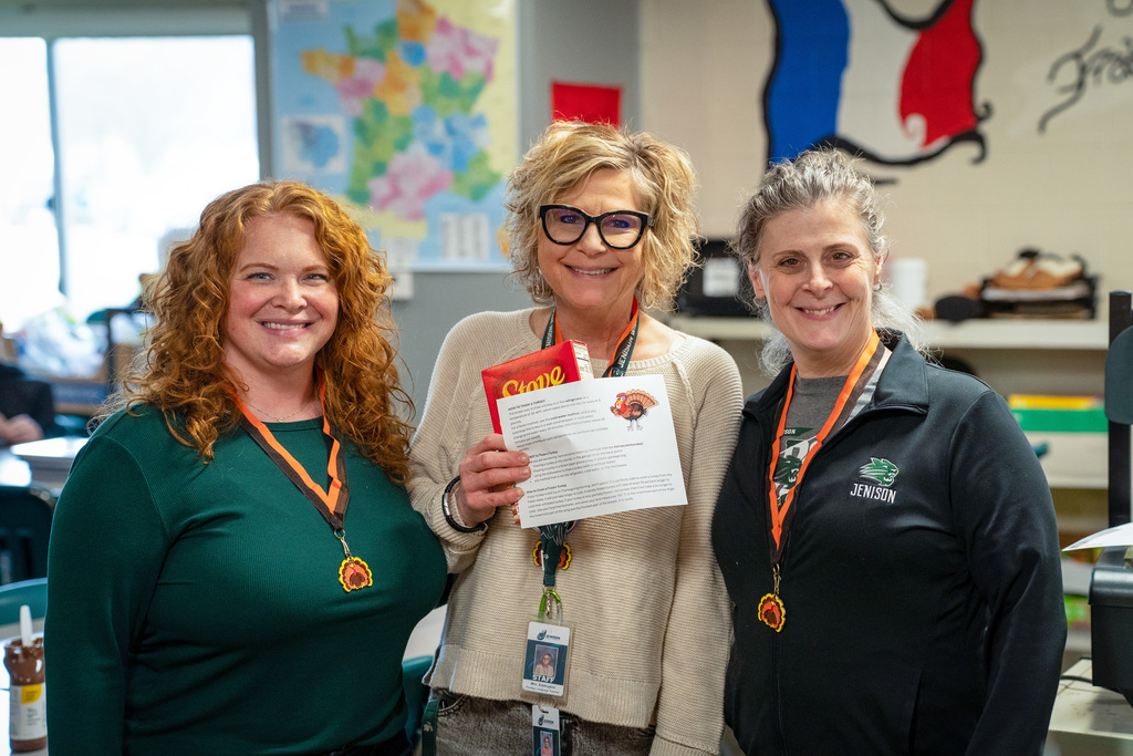 Staff celebrating Winning Wildcat and Strut Your Stuffing