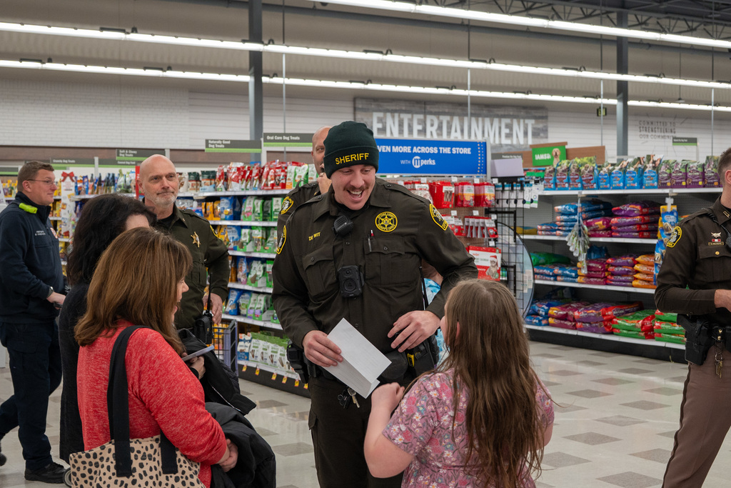 Shop with a Hero volunteers shopping at Meijer