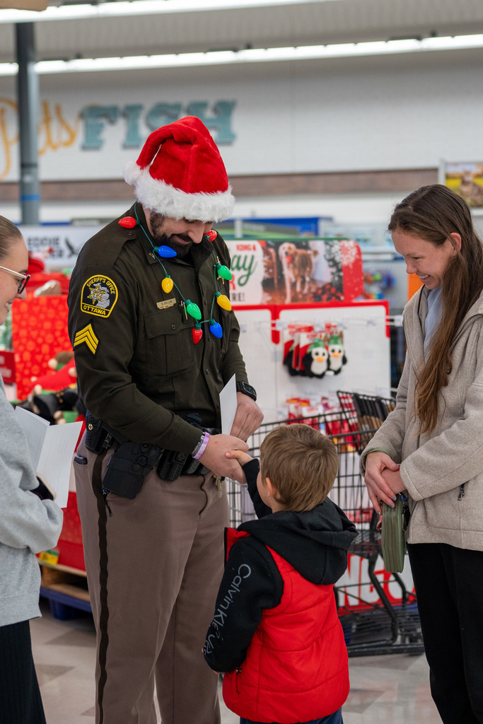 Shop with a Hero volunteers shopping at Meijer