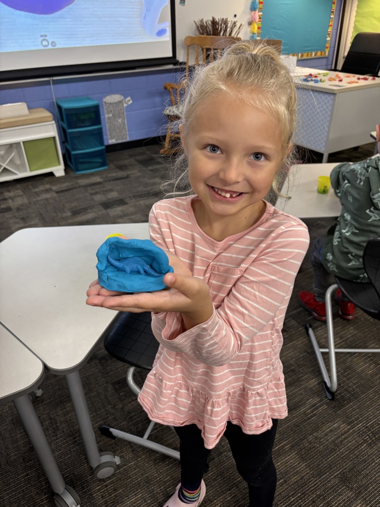 JIA Elementary student making a fossil for a science project