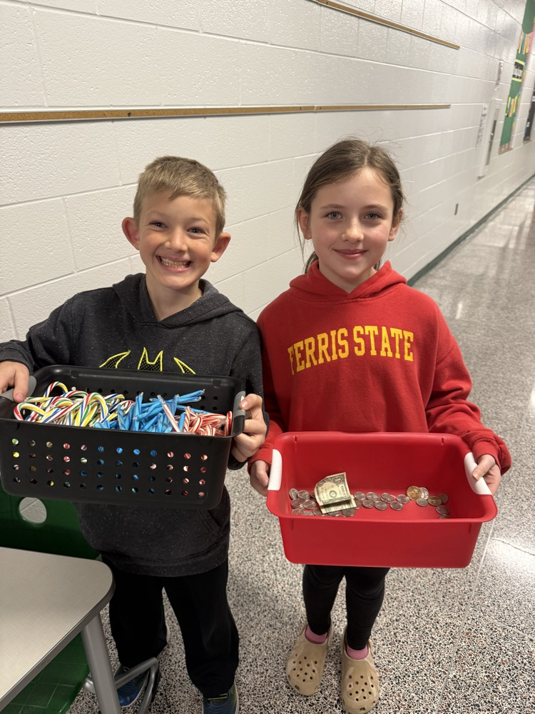 Two students selling candy canes