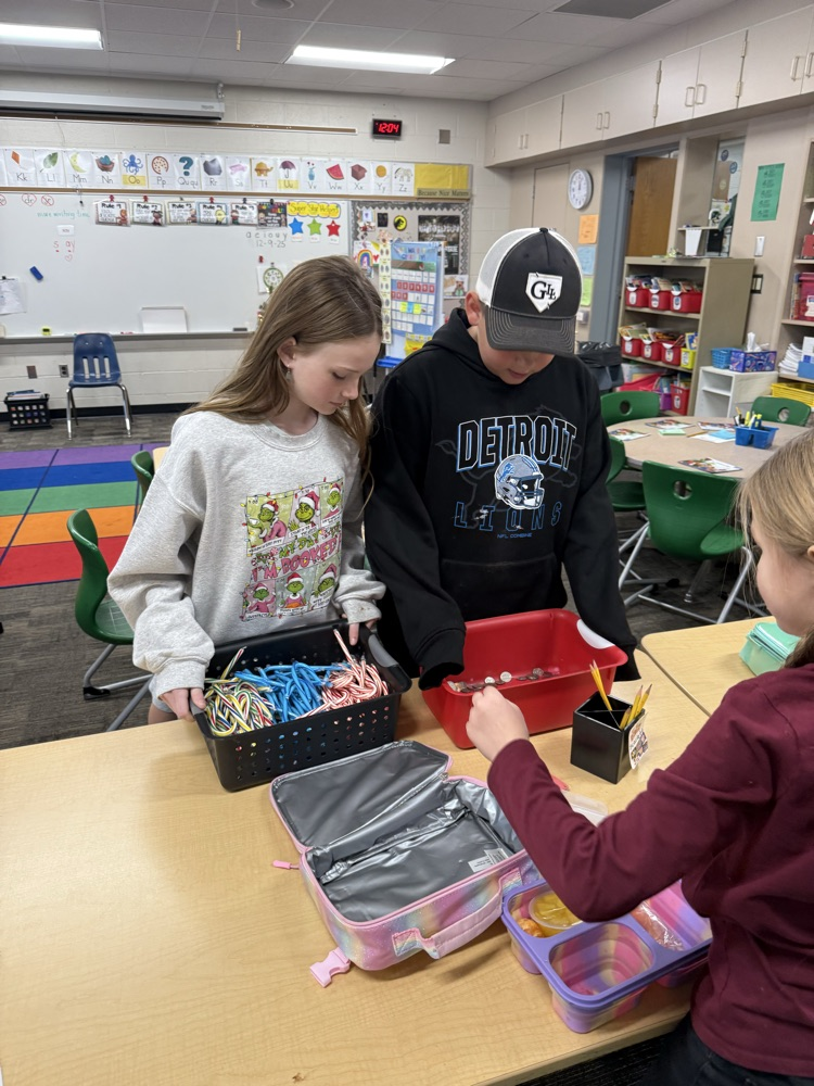 Two students selling candy canes