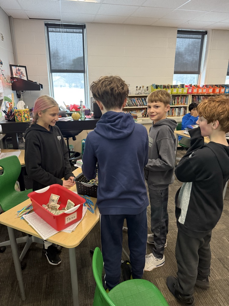 Two students selling candy canes