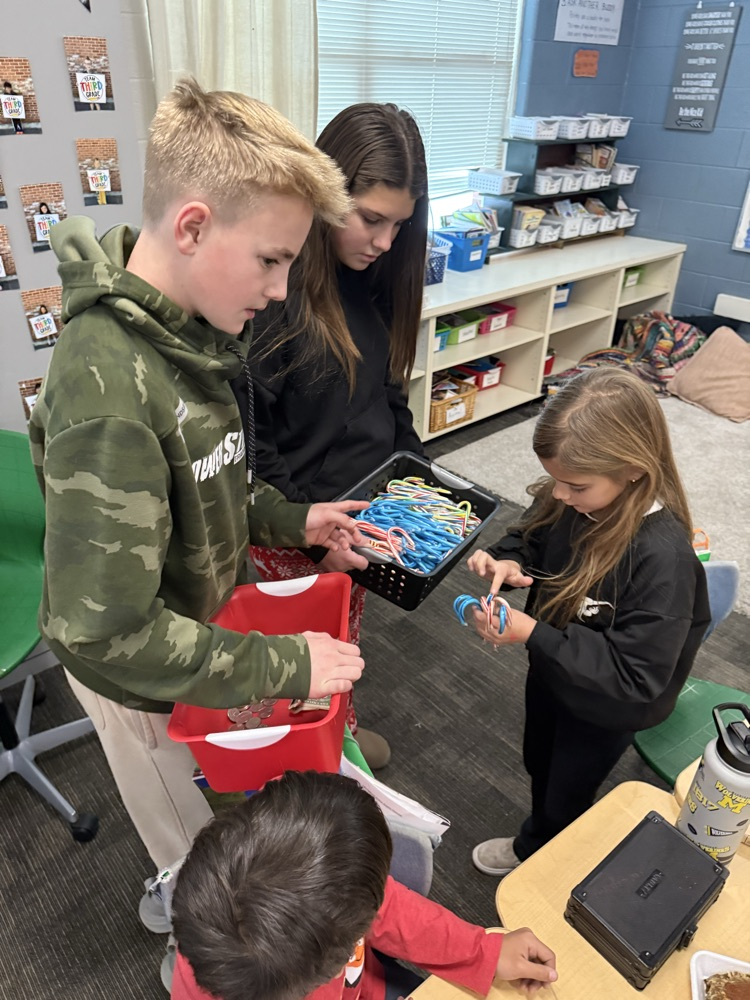 Two students selling candy canes