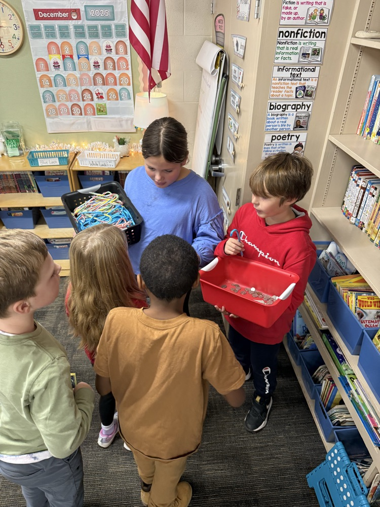 Two students selling candy canes