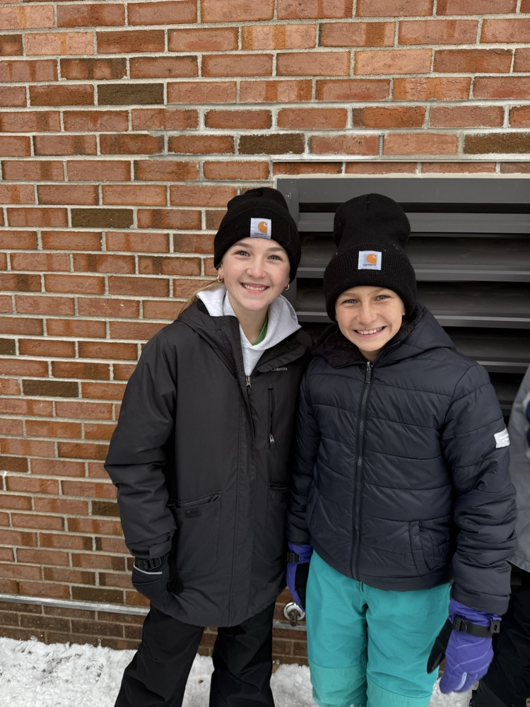 students smiling outside 