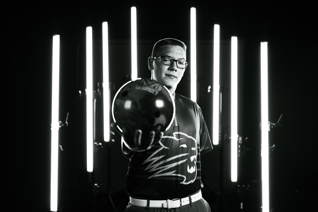Boys bowling team member posing