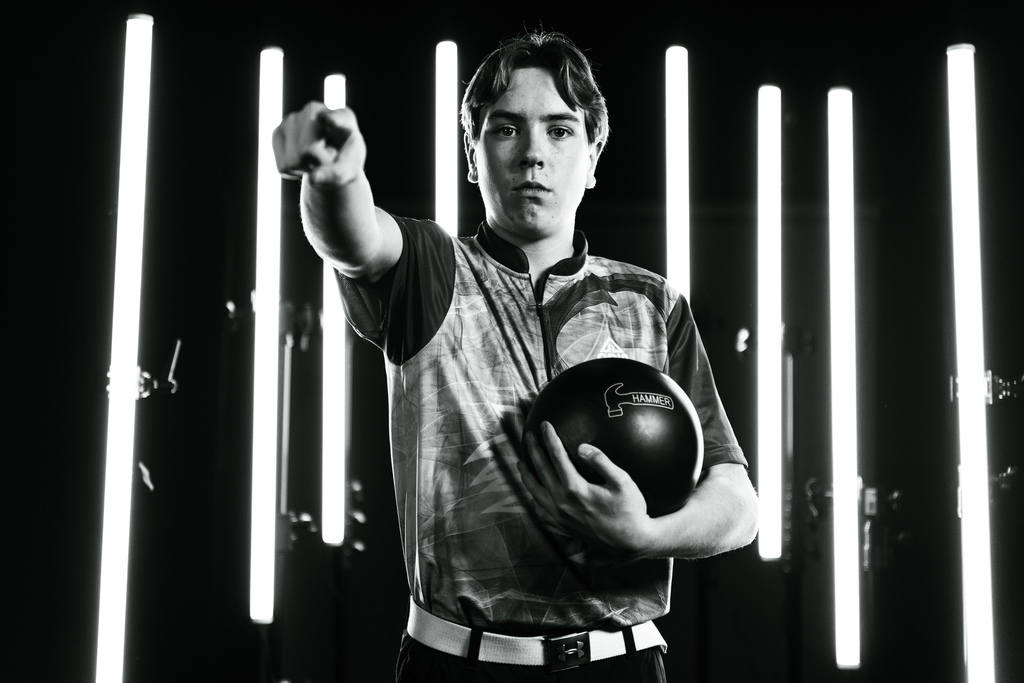 Boys bowling team member posing