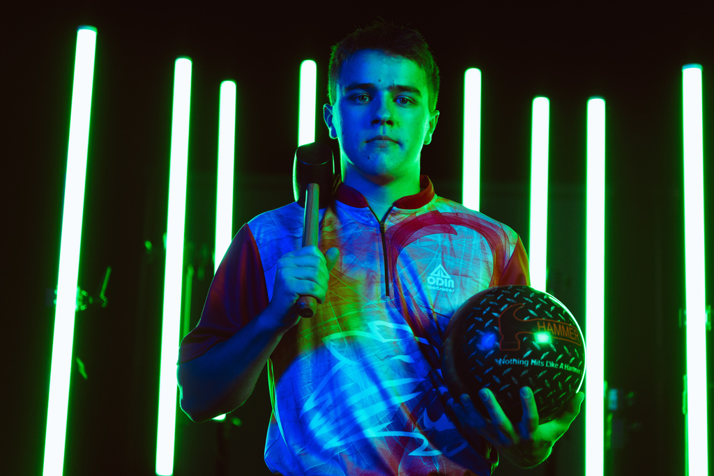 Boys bowling team member posing