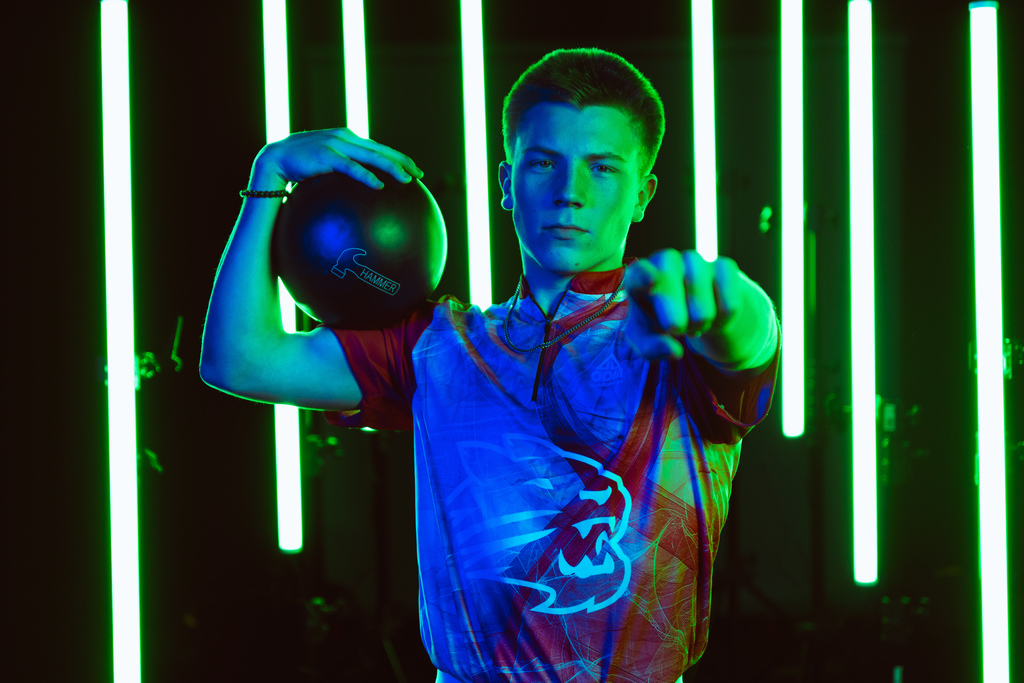 Boys bowling team member posing
