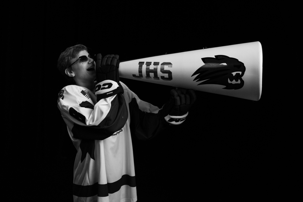 Hockey player posing with megaphone