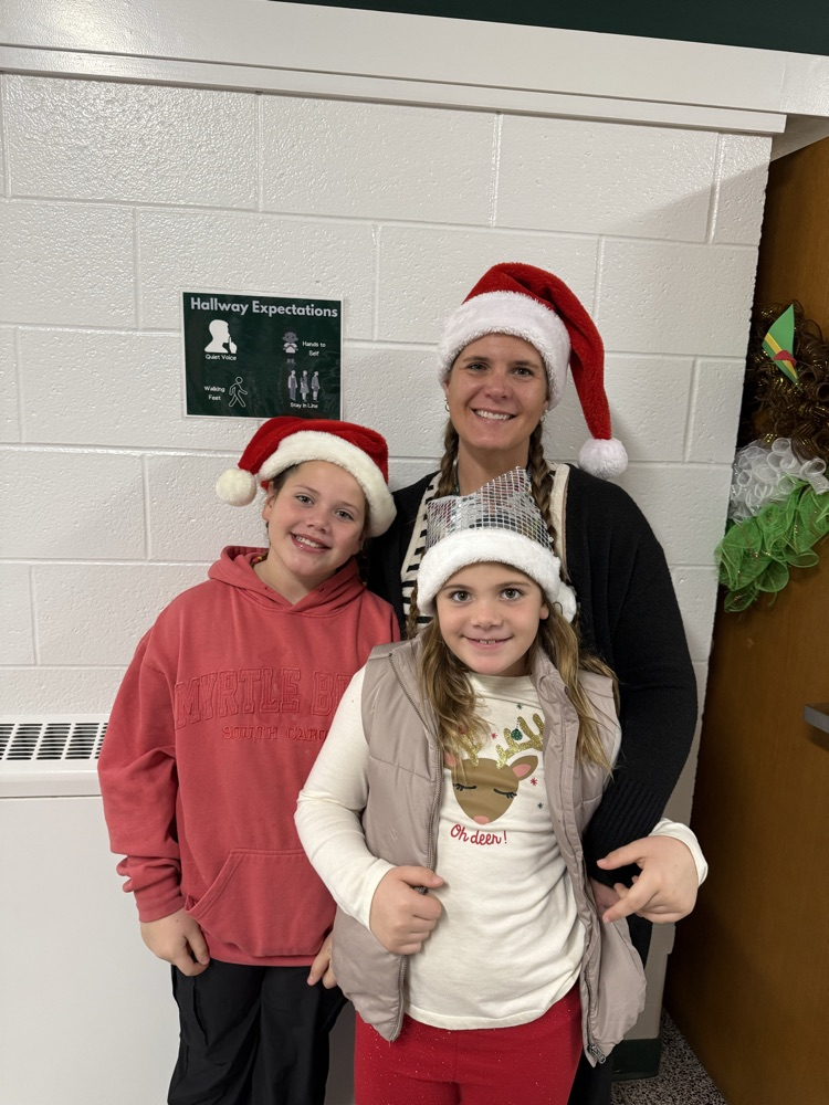 staff and students in holiday clothes 