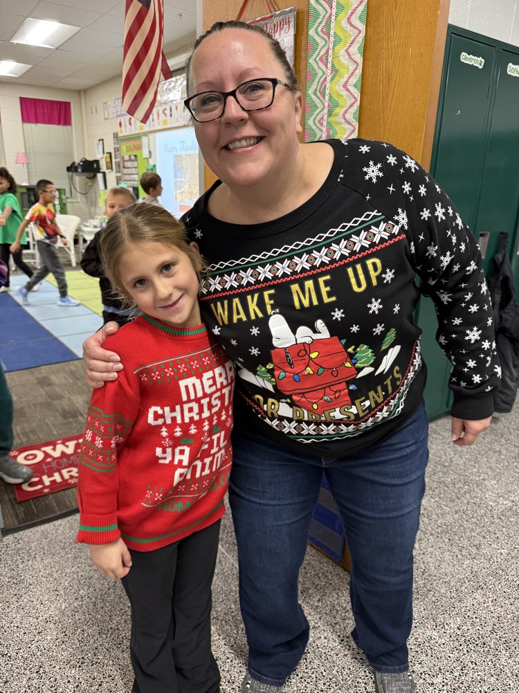 teacher and student in holiday clothes 
