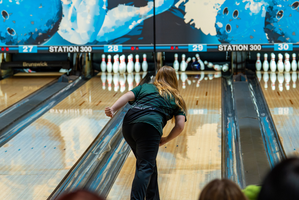 Girls bowling team member bowling