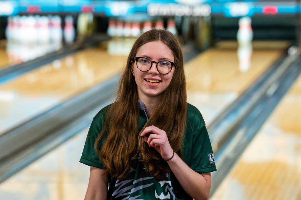Girls bowling team member smiling