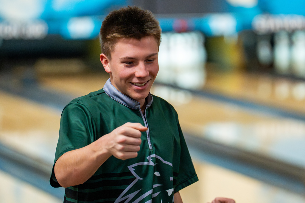 Boys bowling team member smiling