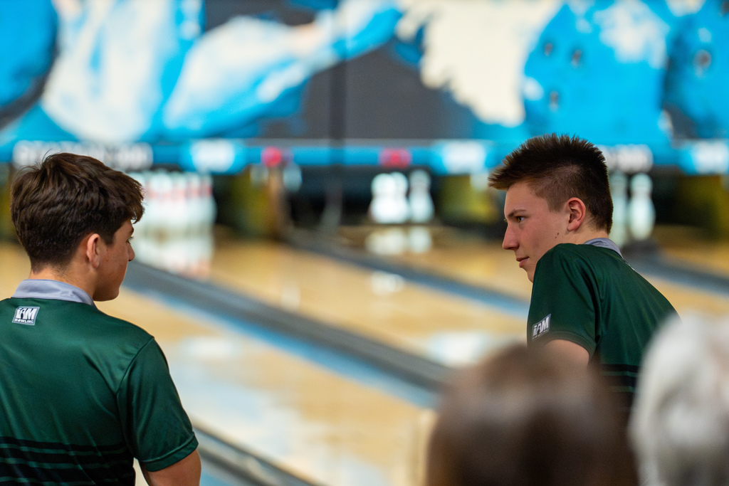 Boys bowling team members smiling