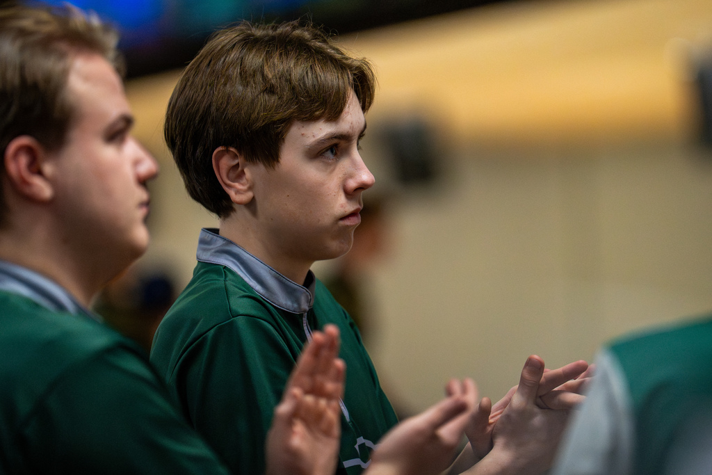 Bowling team member clapping