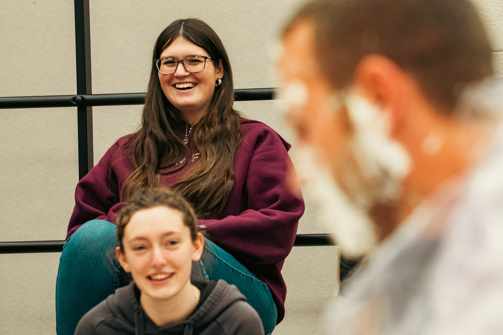 Students laughing at teacher getting pied
