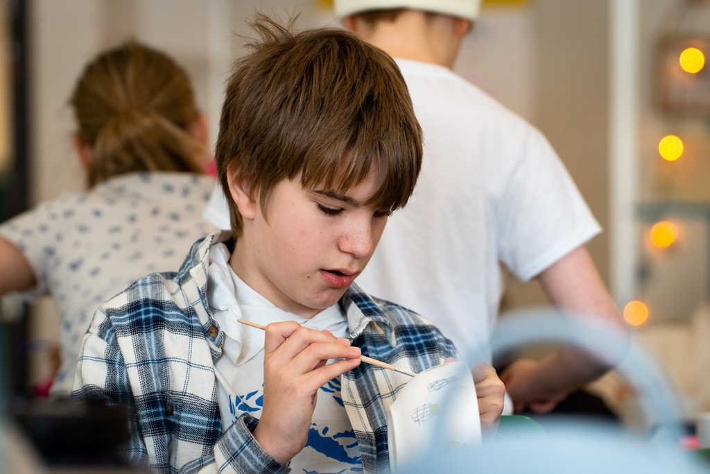 Students painting soup bowls