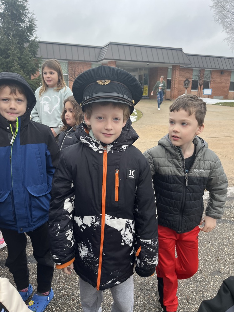 student trying on police hat