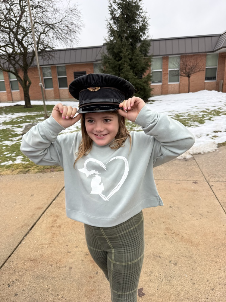 student trying on police hat
