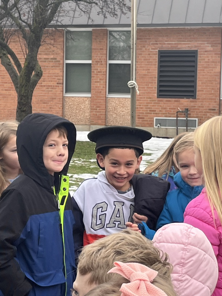 student trying on police hat