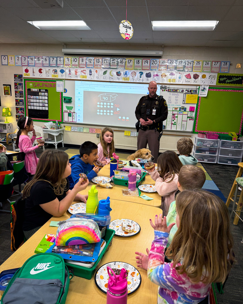 Police officer talking to students