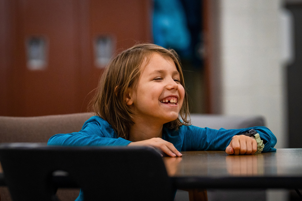 Student smiling in classroom