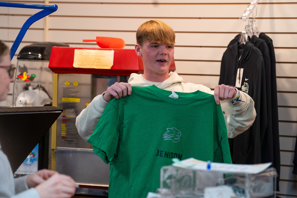 Cats Corner employee talking to students