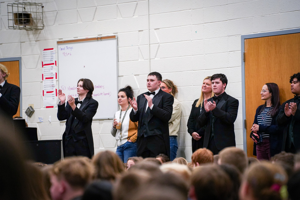 Choir members clapping