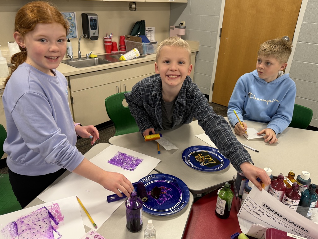 JIA Elementary Students working on a project at school