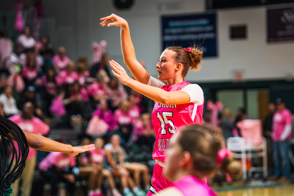 Girls basketball player shooting
