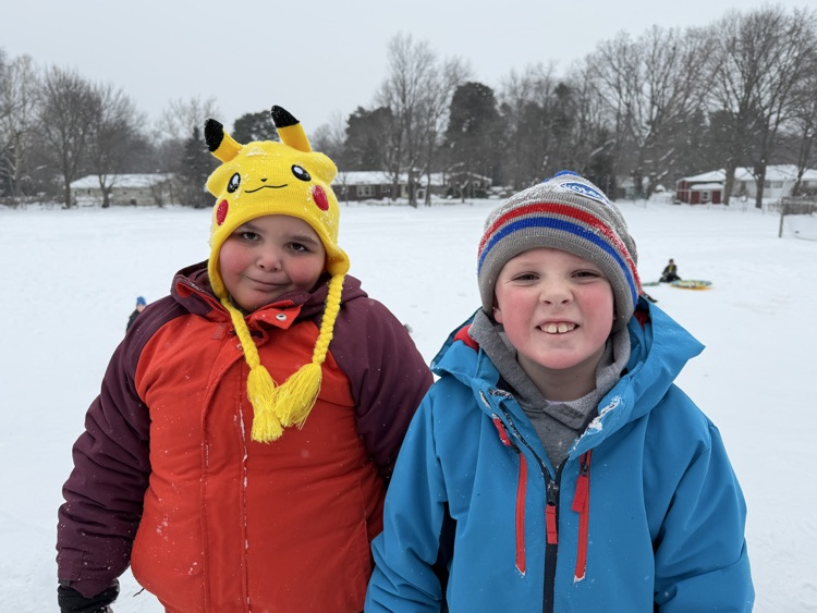 students smiling outside 