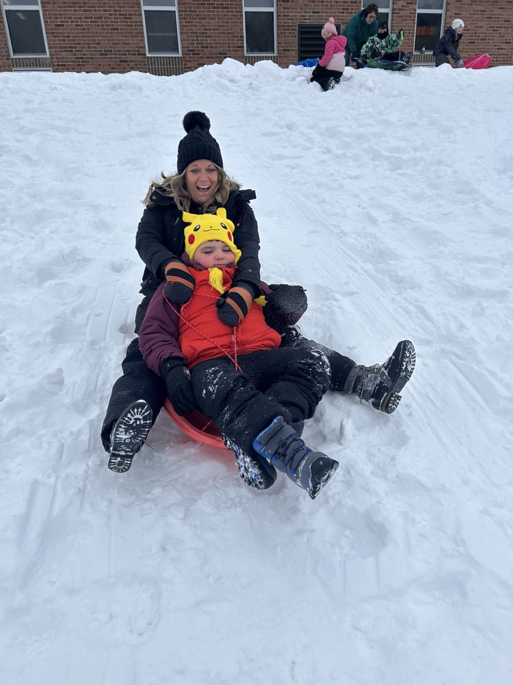 teacher and student sledding 