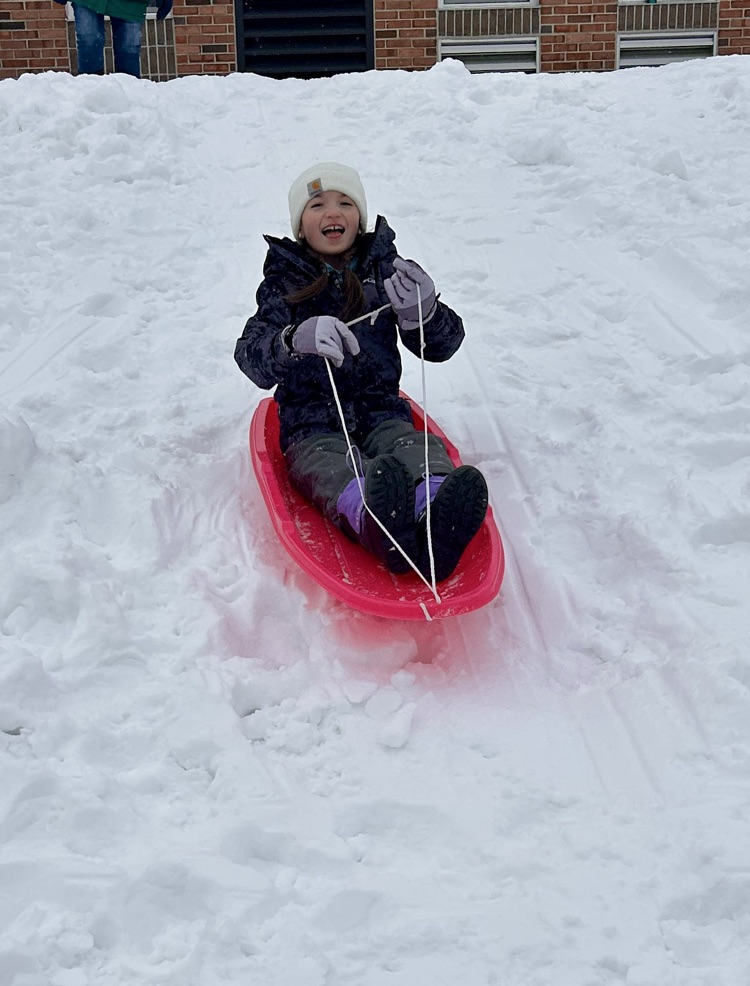 student sledding 