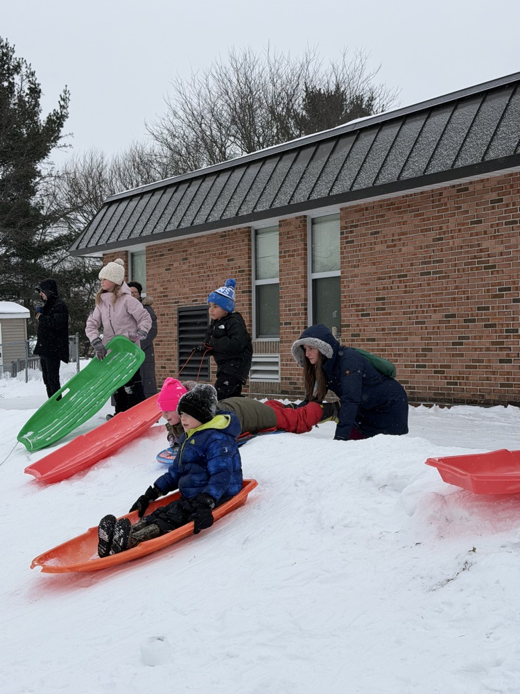 students sledding 
