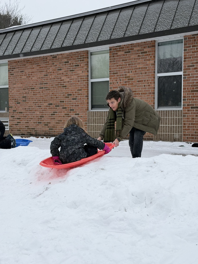 students sledding 