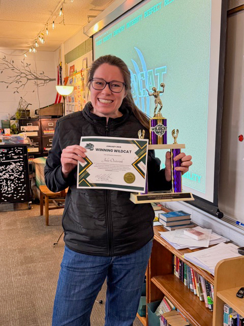 Julie smiling with award