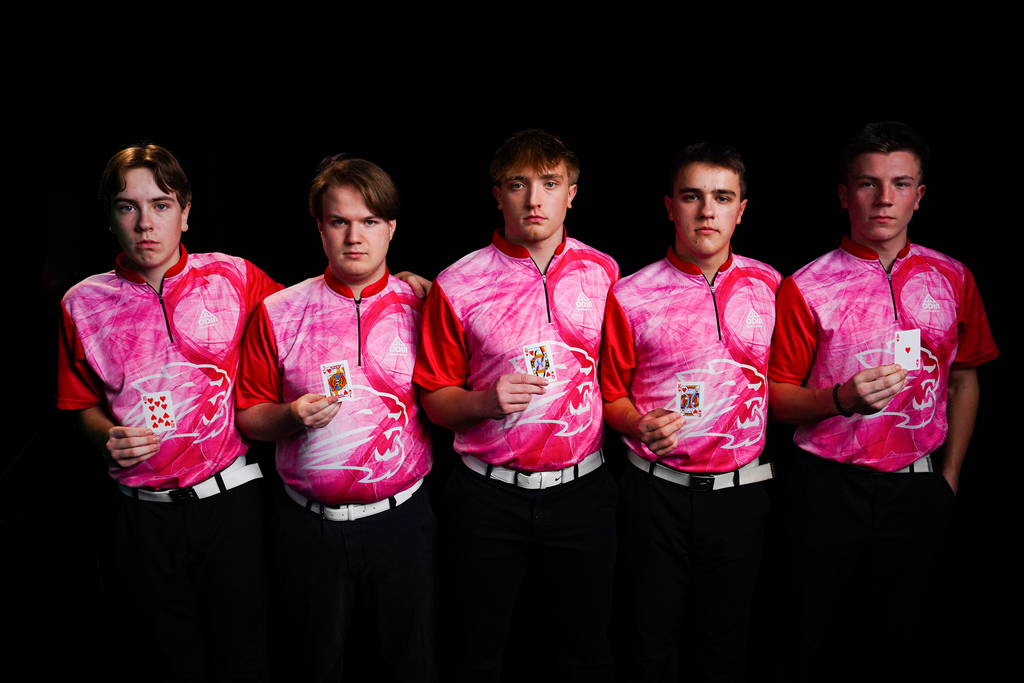 Boys bowling team with playing cards