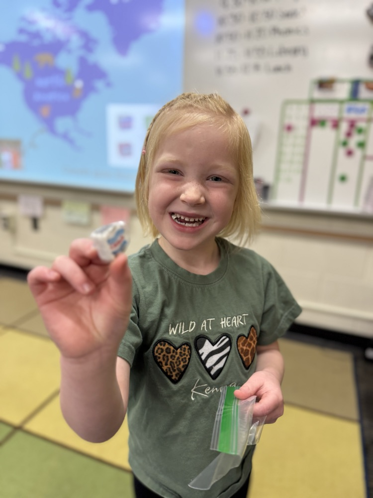 student smiling with candy