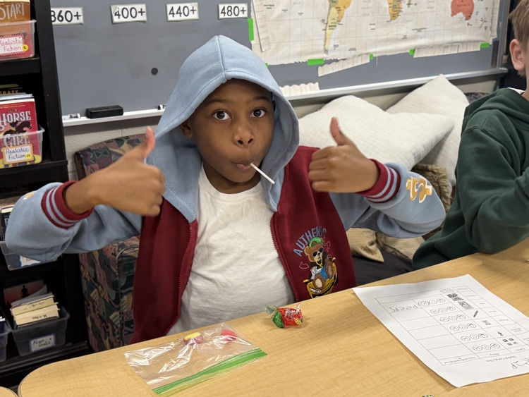 student smiling with candy