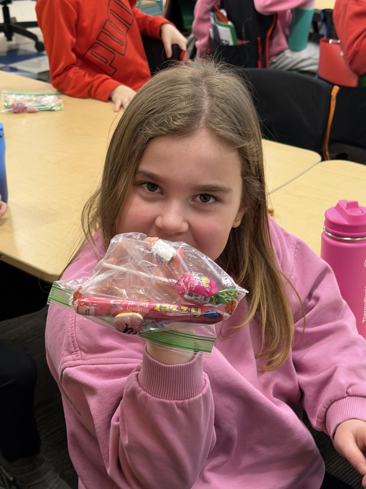 student smiling with candy