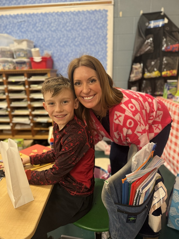 teacher and student smiling