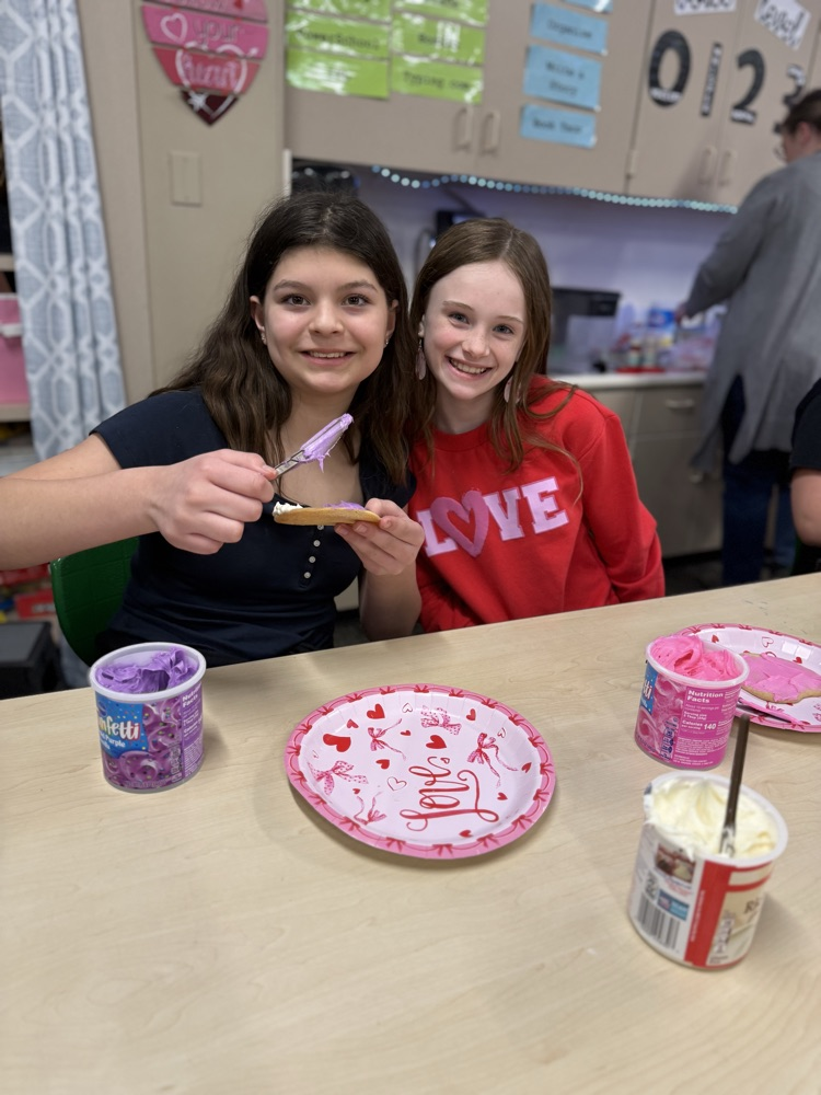 students decorating cookies 
