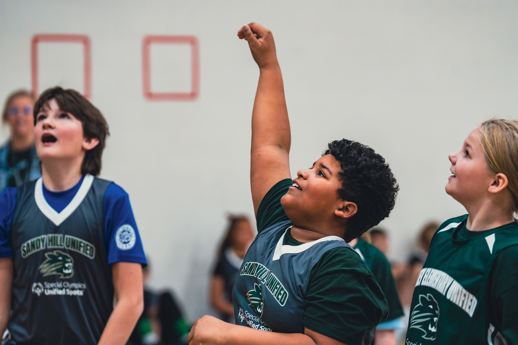 Elementary Unified student shooting a basket