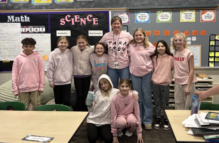 students and teacher smiling together